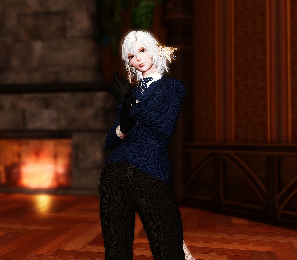 A sleek blond raen in a suit.